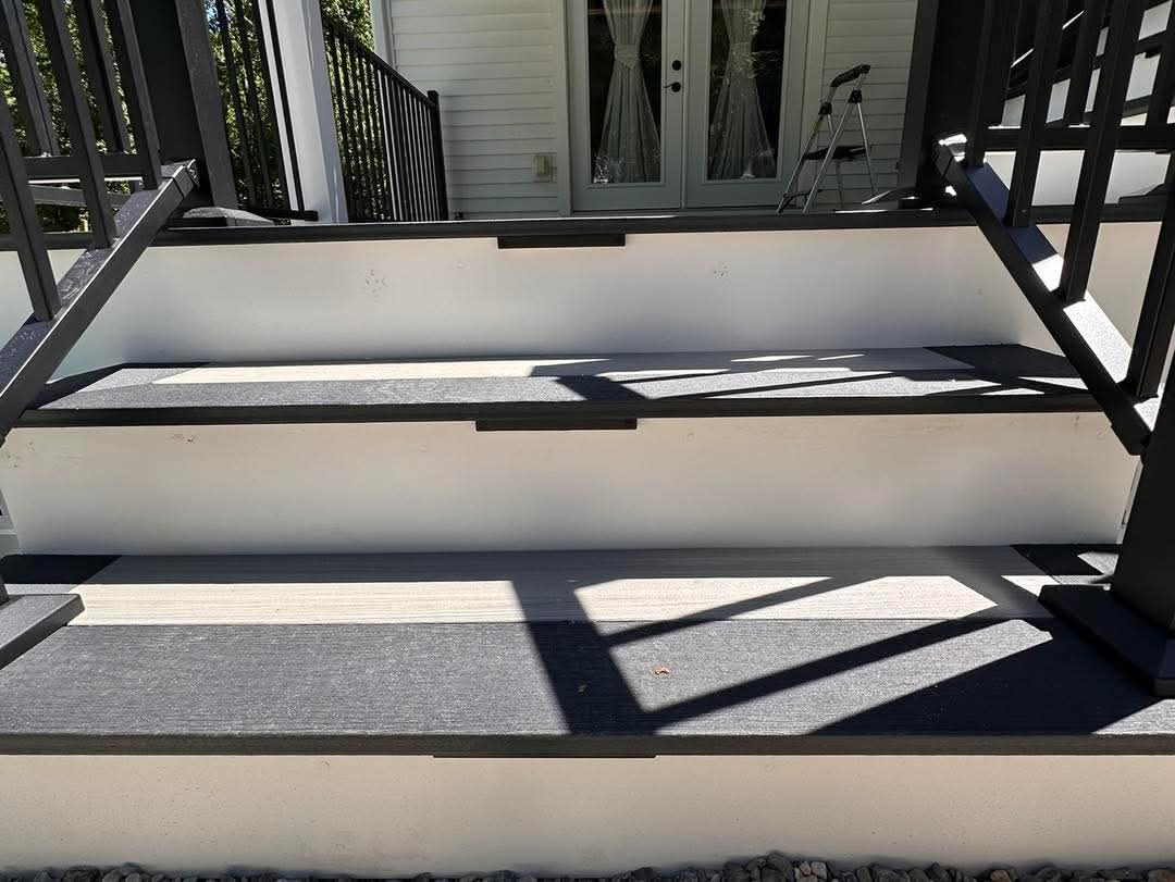 Close-up of Deckorators Summit Glacier stair treads with a slate border detail