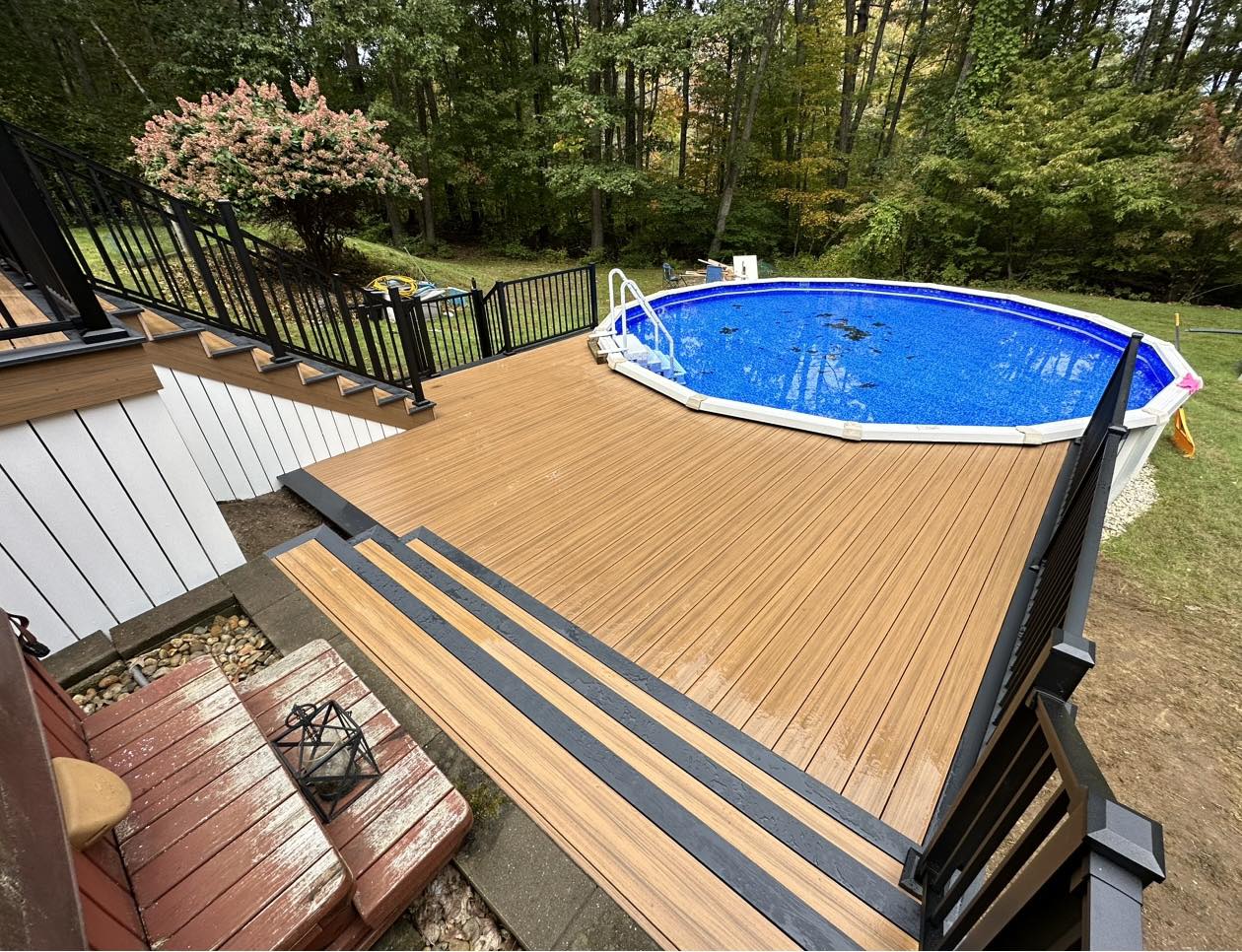 Above-ground pool deck with wraparound composite decking