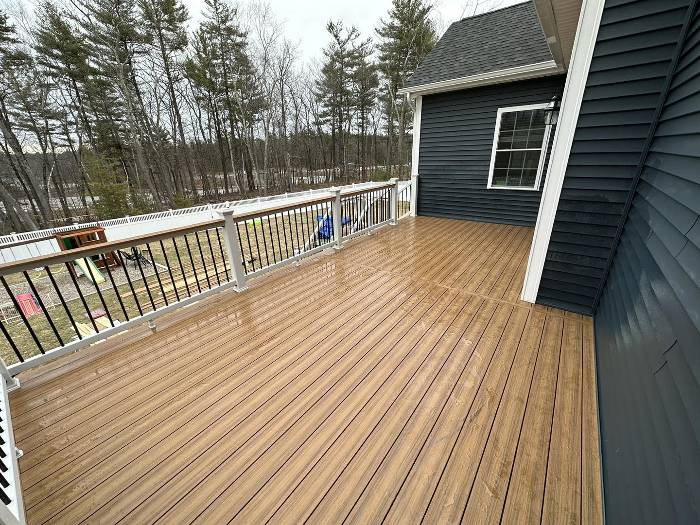 Premium composite deck with outdoor furniture in Southern New Hampshire — 2026 spring deck trends