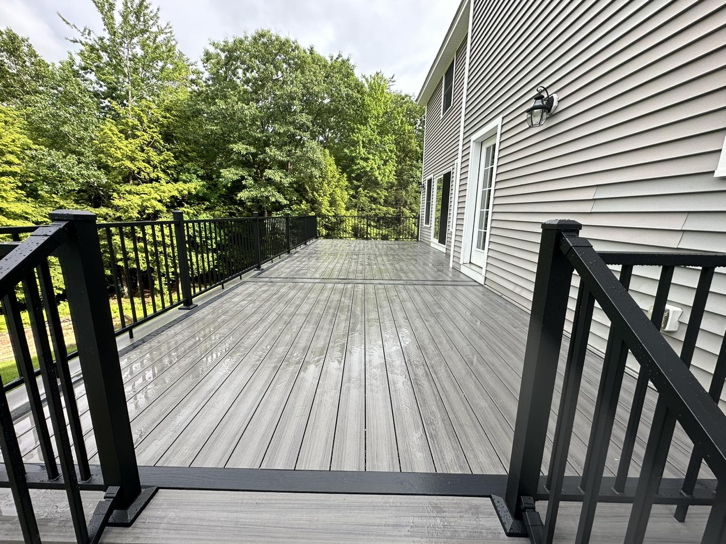 Completed composite deck with matching stairs and railing