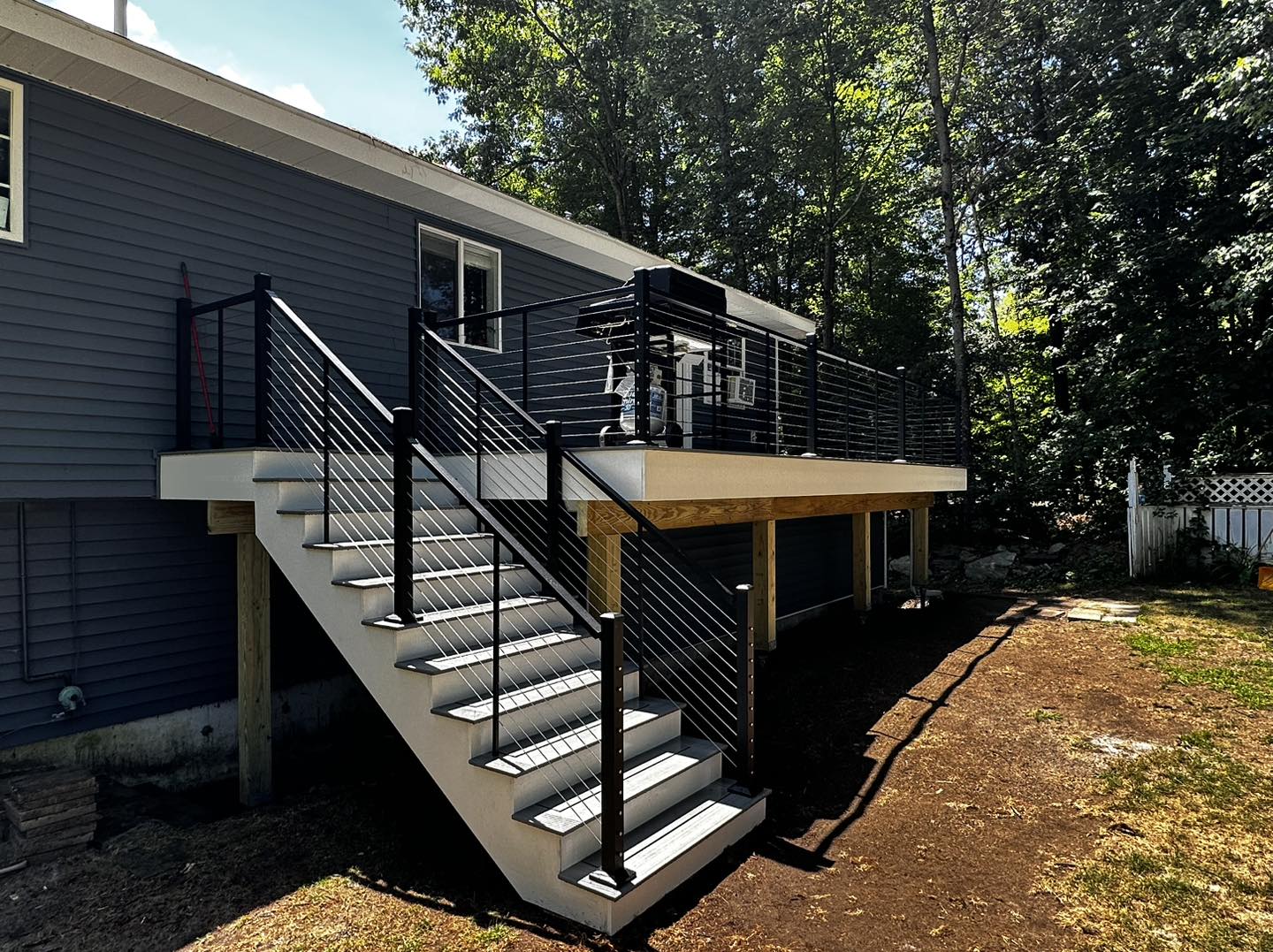 Elevated deck with cable railing and stairs